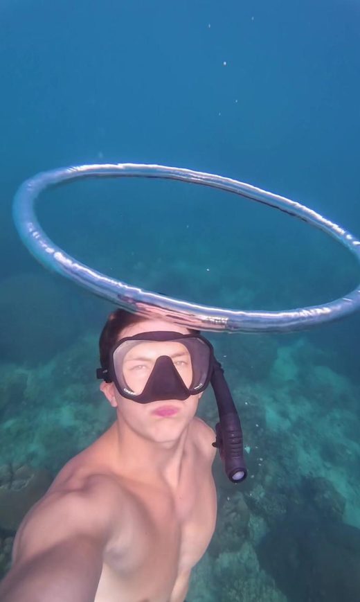 George with a large bubble ring just above his head over a reef